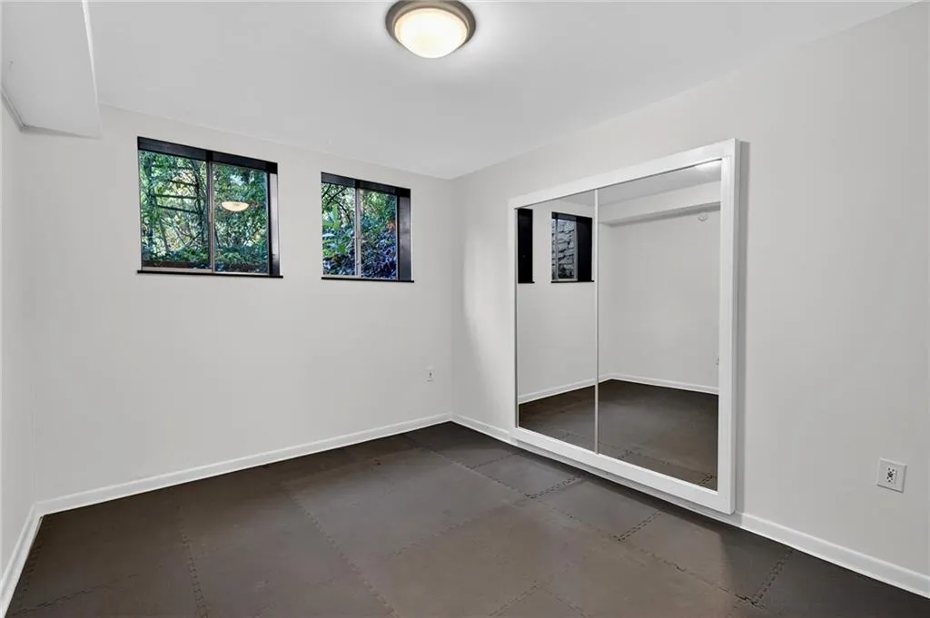 Unfurnished bedroom featuring baseboards and a closet