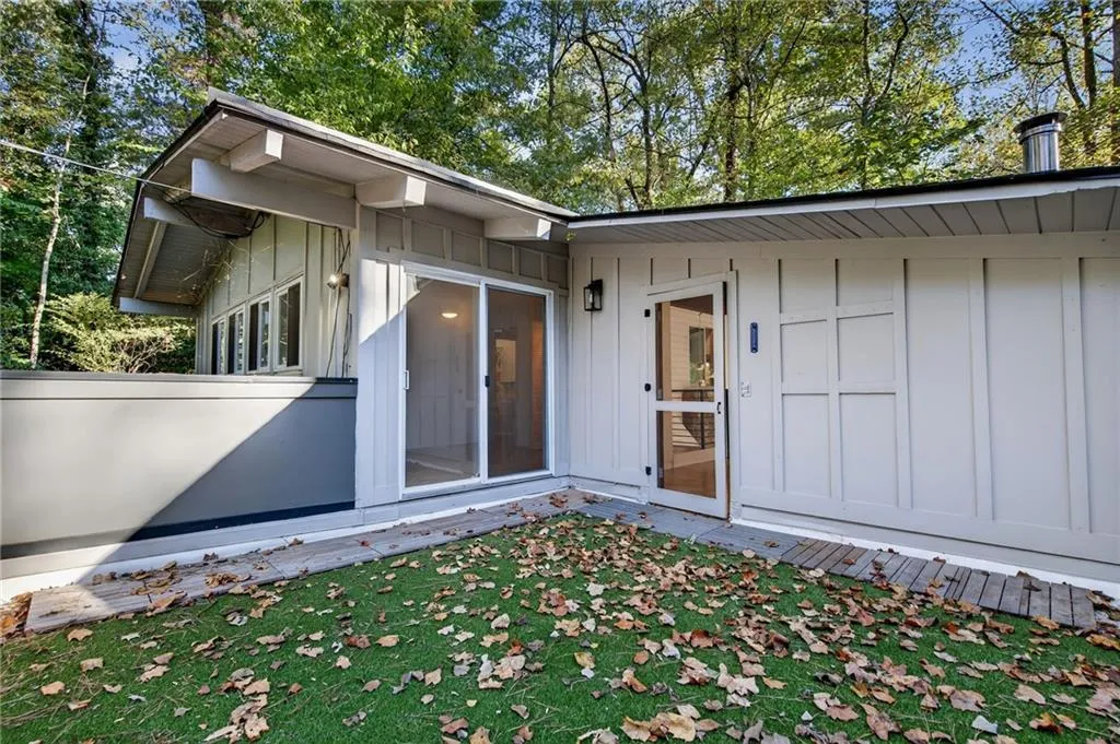 View of exterior entry featuring board and batten siding