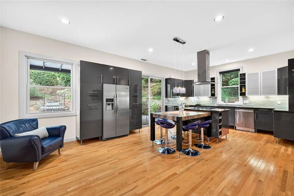 Stainless steel appliances and inviting Kitchen spaces