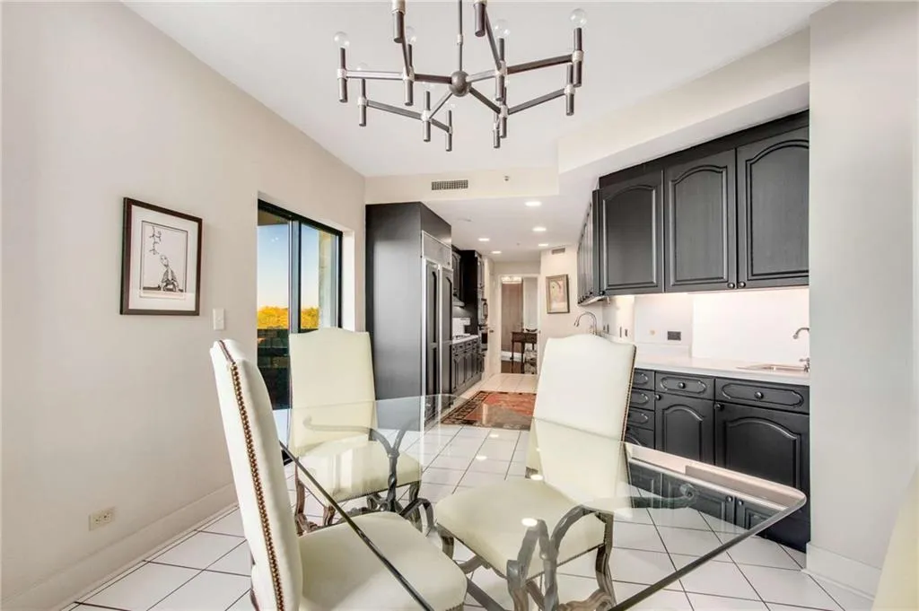 Dining area featuring a chandelier and light tile patterned floors