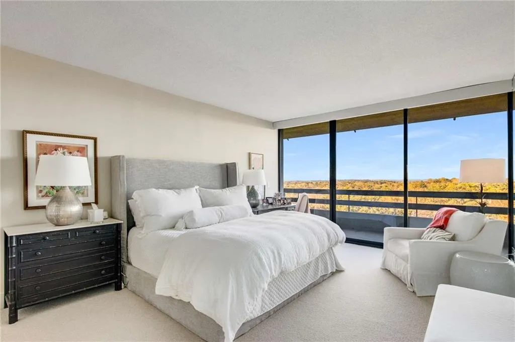 Carpeted bedroom featuring access to outside and floor to ceiling windows
