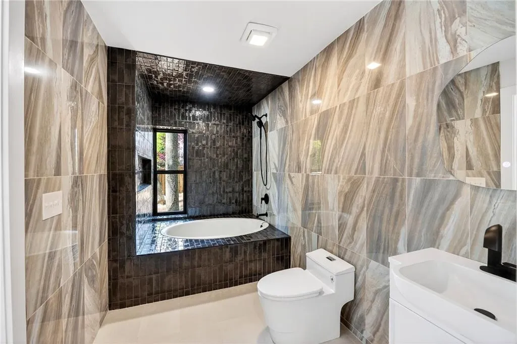 Gleaming bathroom with soaking tub