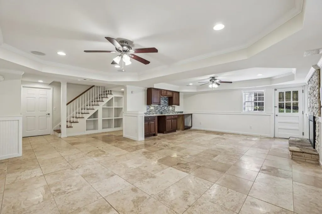 Entertainer's Dream In The Basement With A Large Entertaining Area, Fireplace, Wet Bar, & Full Bath