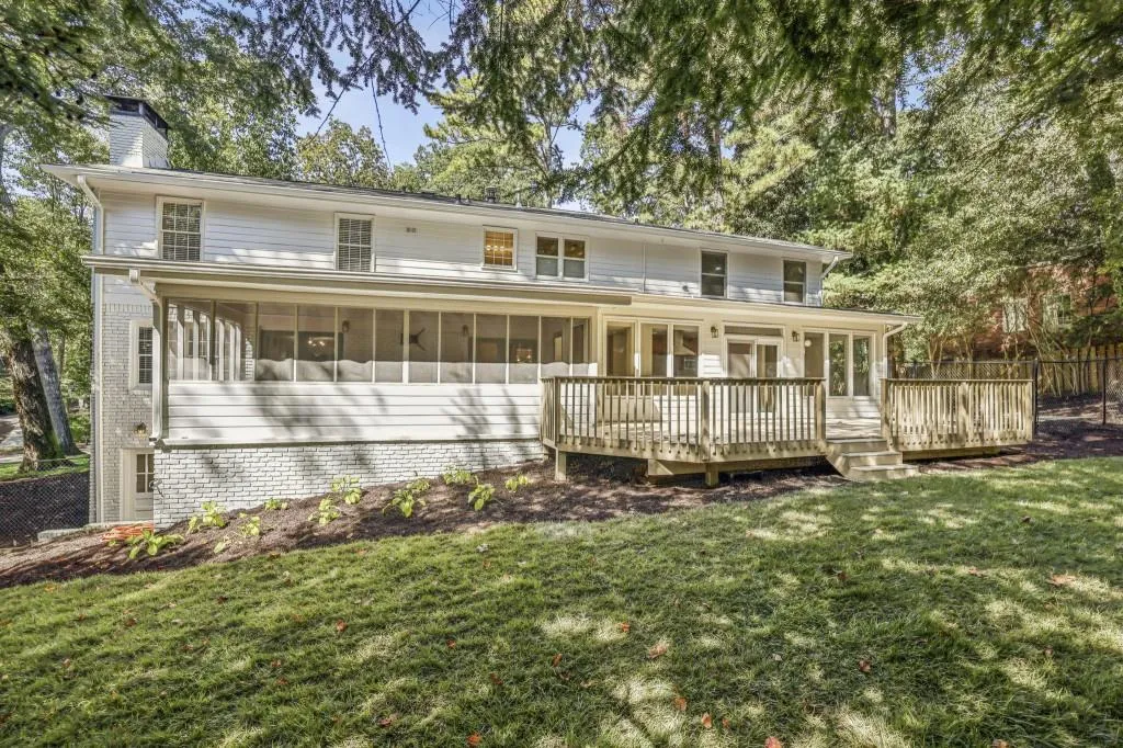 Outdoor Living Is A Dream With A Screened Porch, Rear Deck, & Fully Fenced Yard