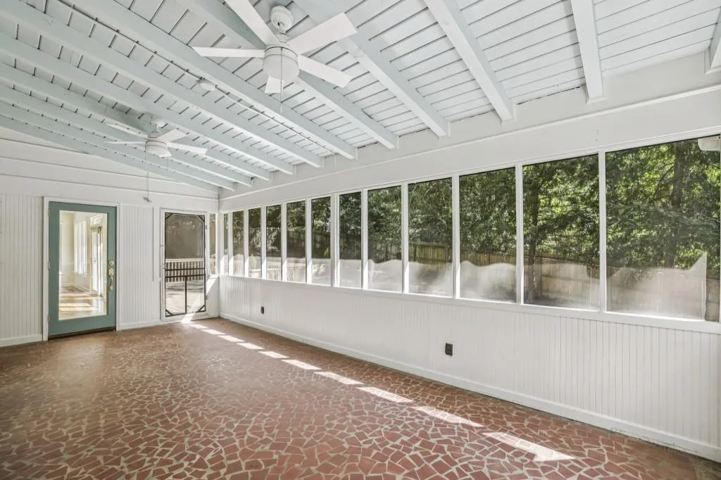 Expansive Screened Porch Overlooking The Fully Fenced Backyard
