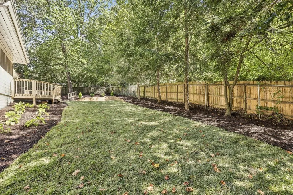 Outdoor Living Is A Dream With A Screened Porch, Rear Deck, & Fully Fenced Yard