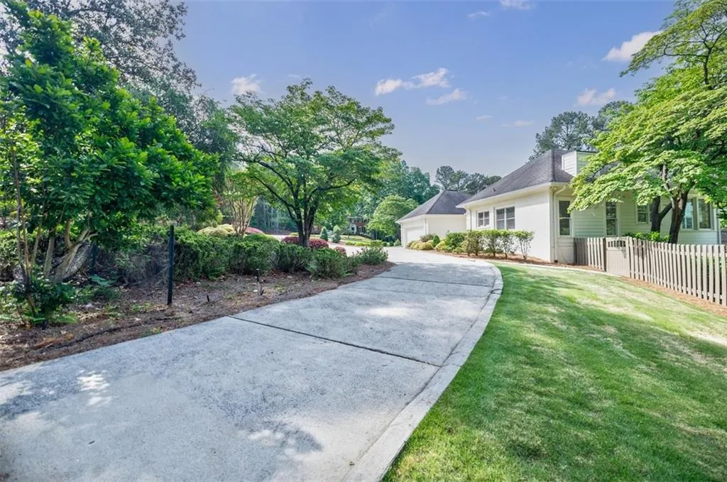 Driveway Extends Offering Plenty of Space for More Parking or Garage Addition - Or a Sports/Pickleball Court
