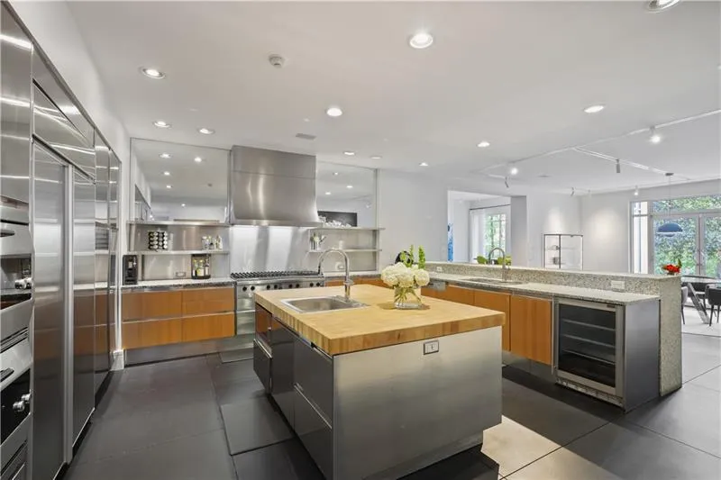 Top-of-the-line appliances and view to breakfast room and private backyard Top-of-the-line appliances and view to breakfast room and private backyard