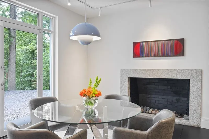 Stone fireplace and overlooks the private backyard. Stone fireplace and overlooks the private backyard.