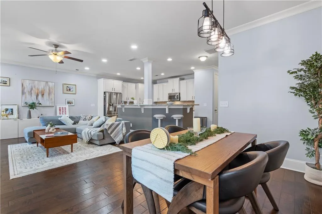 Dining area with pedant lights, viewing to the family room