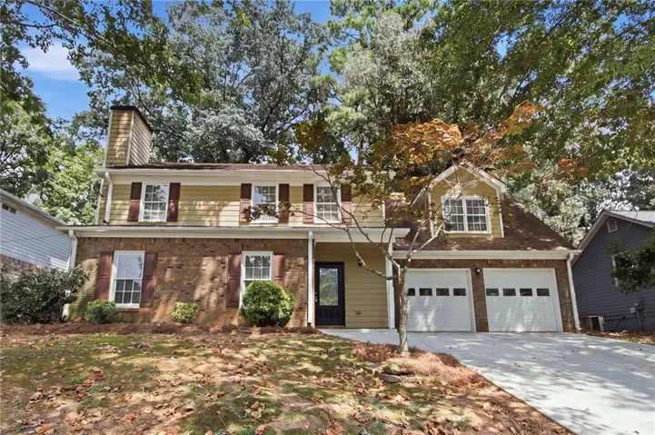Brick and siding exterior with a two-car garage