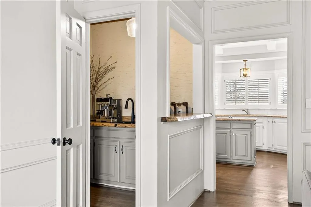 Custom wet bar with reverse osmosis water filtration system (perfect for maximizing the taste of your coffee) and the ideal space for coffee in the mornings and drinks in the evening - outfitted with custom cabinetry, custom wine rack and reclaimed wood countertops.