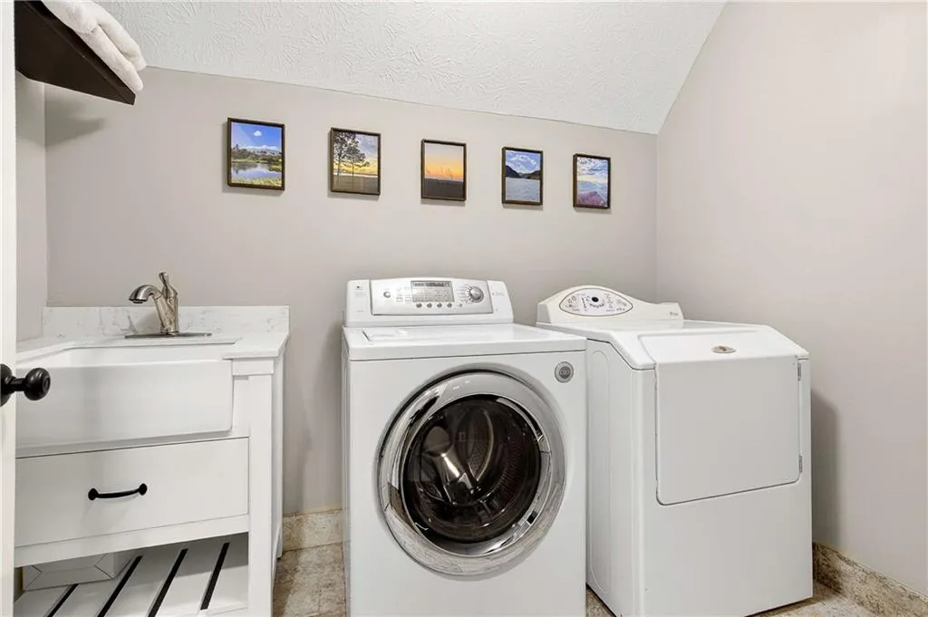 Renovated laundry room with sink is conveniently located on the same floor as the majority of the bedrooms! No more trecking laundry up and down stairs!