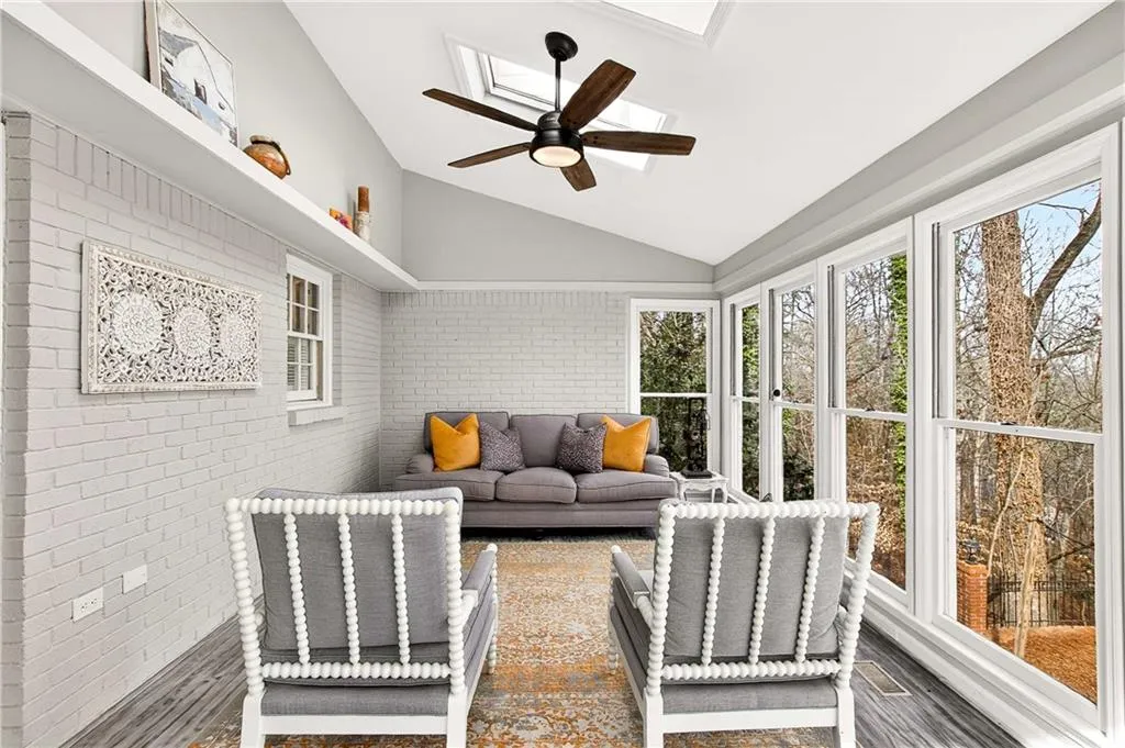 Walk out into this light-filled sunroom that is heated & cooled for the ultimate comfort!