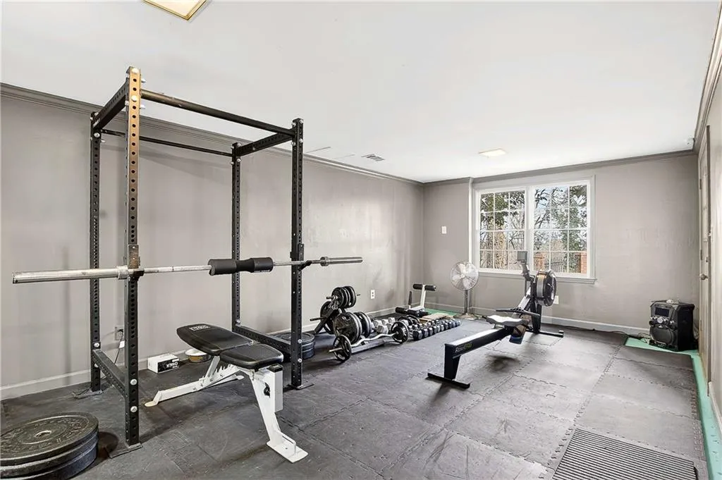 The basement bedroom is currently being used as a home gym but includes a closet and vanity area which could be easily converted back into a bedroom if you should need it.