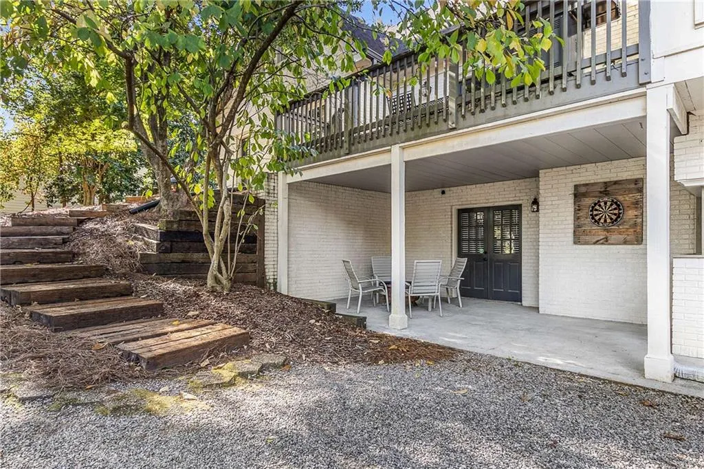 Covered patio off the basement features under-decking gutter system to keep rain from dampening your fun!