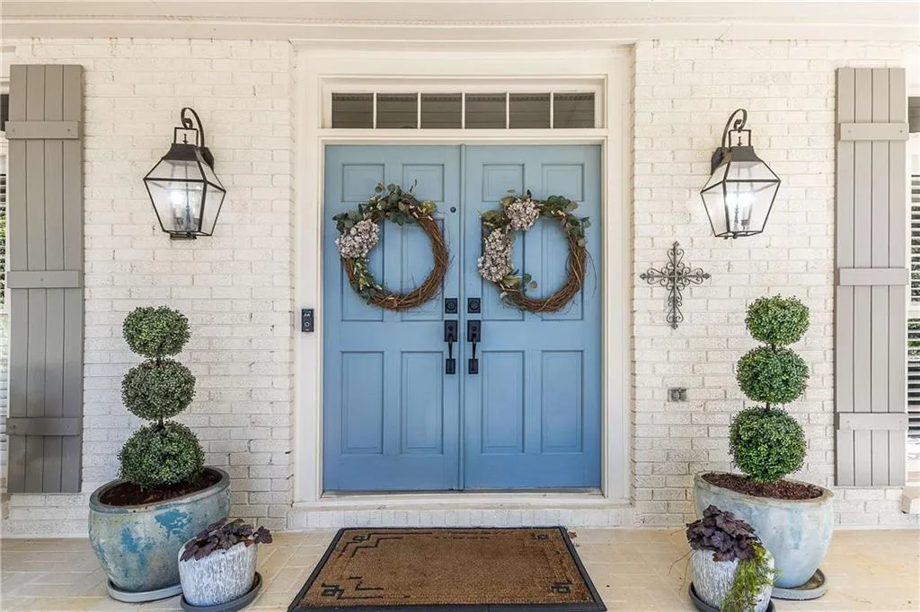 The double front door entry are a beautiful blue color and instantly make you feel 