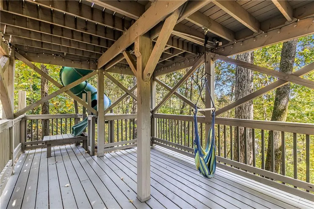 Take the slide from the top to the bottom and hang out in your hammock while reading a book!