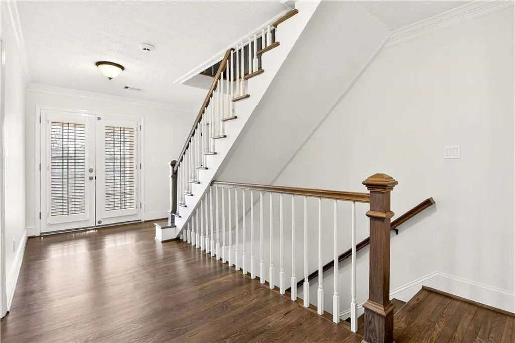 Second floor hallway/landing features refinished hardwood floors, an entrance onto the upper porch (with Trex decking) and stairs to the third floor bonus room!
