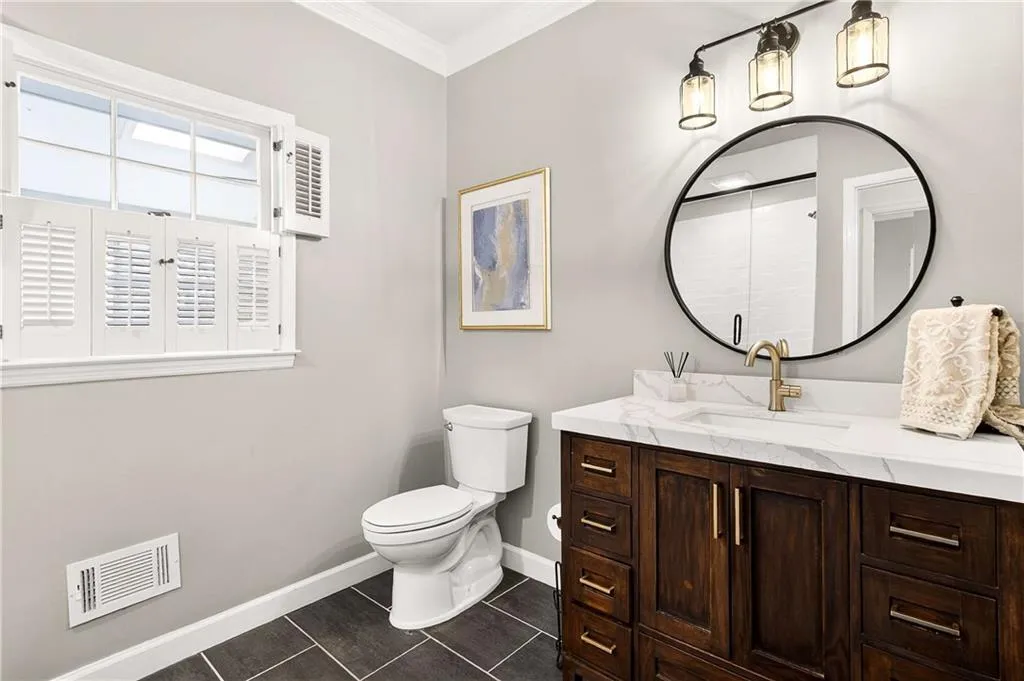 Main level full bathroom is totally renovated and features a walk-in shower!