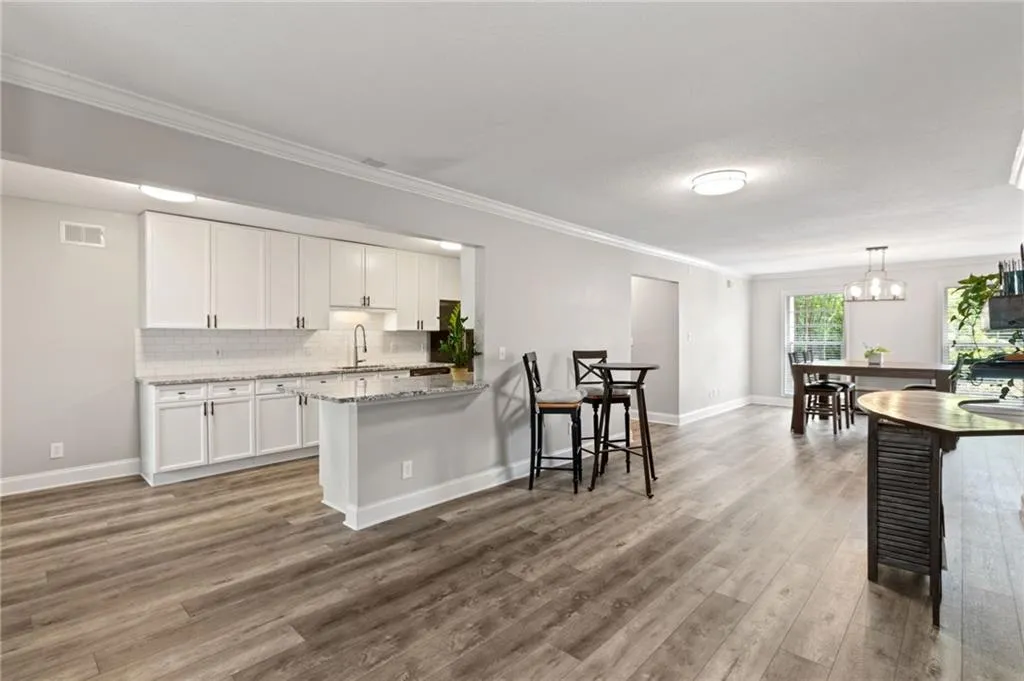 View from living area into kitchen and dining area.