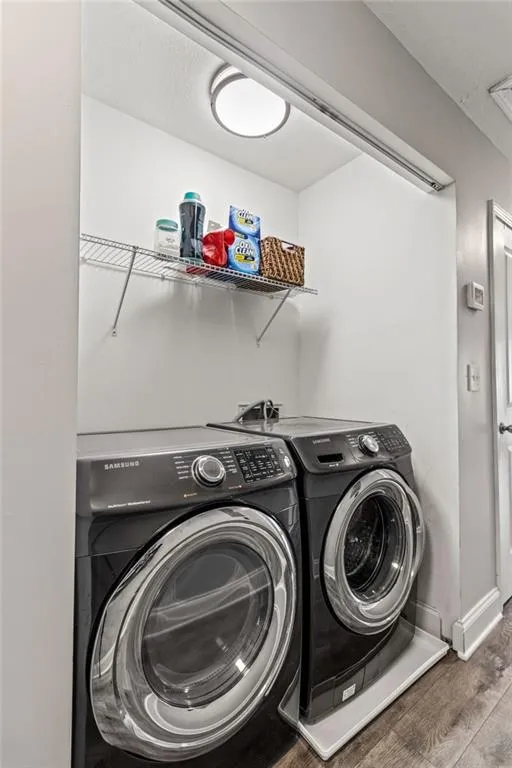 Laundry is located in hallway.