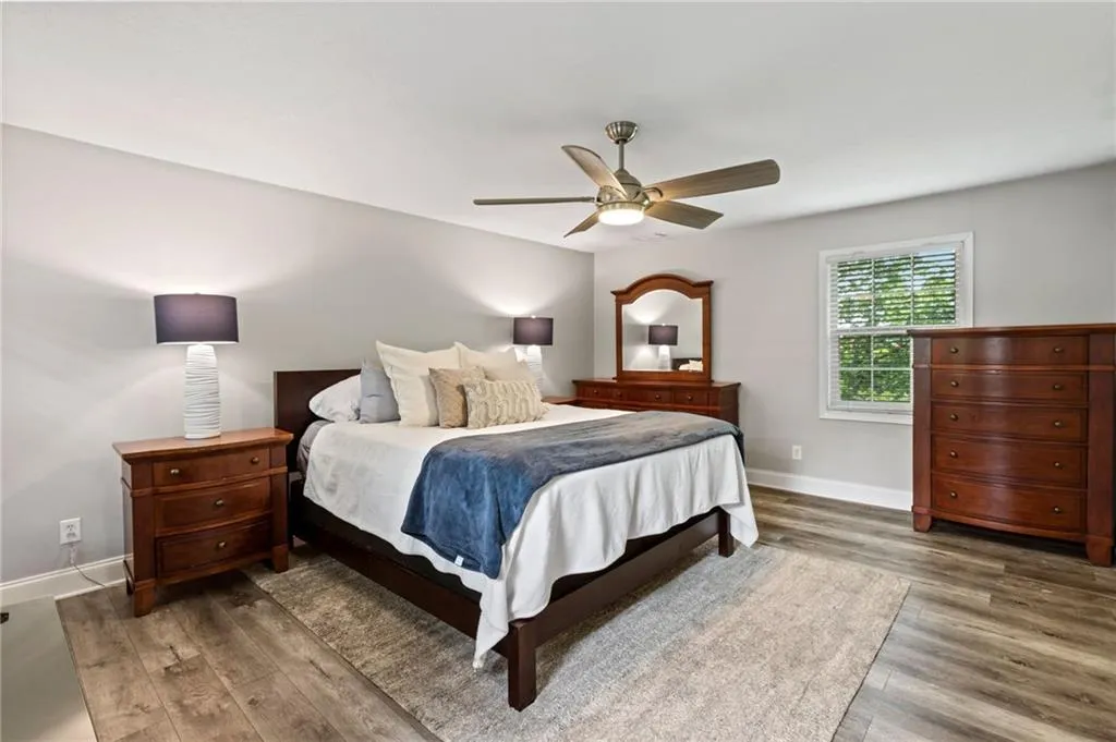 Primary suite has windows on two walls.