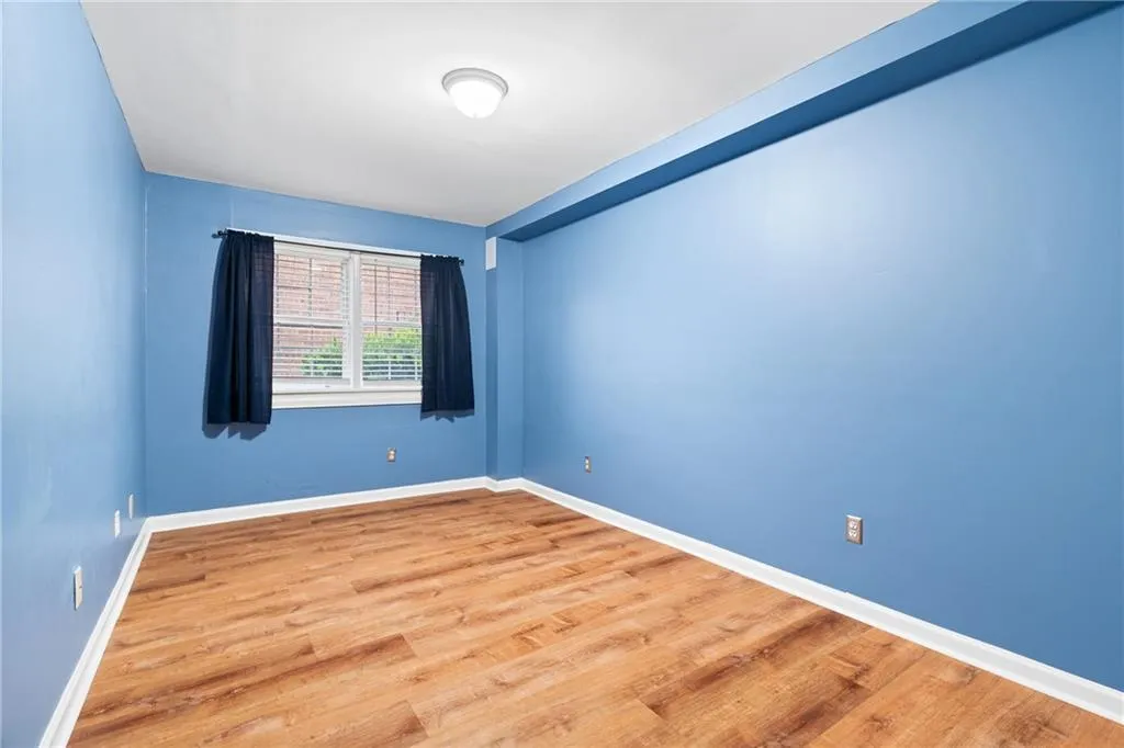 Unfurnished room featuring hardwood / wood-style flooring