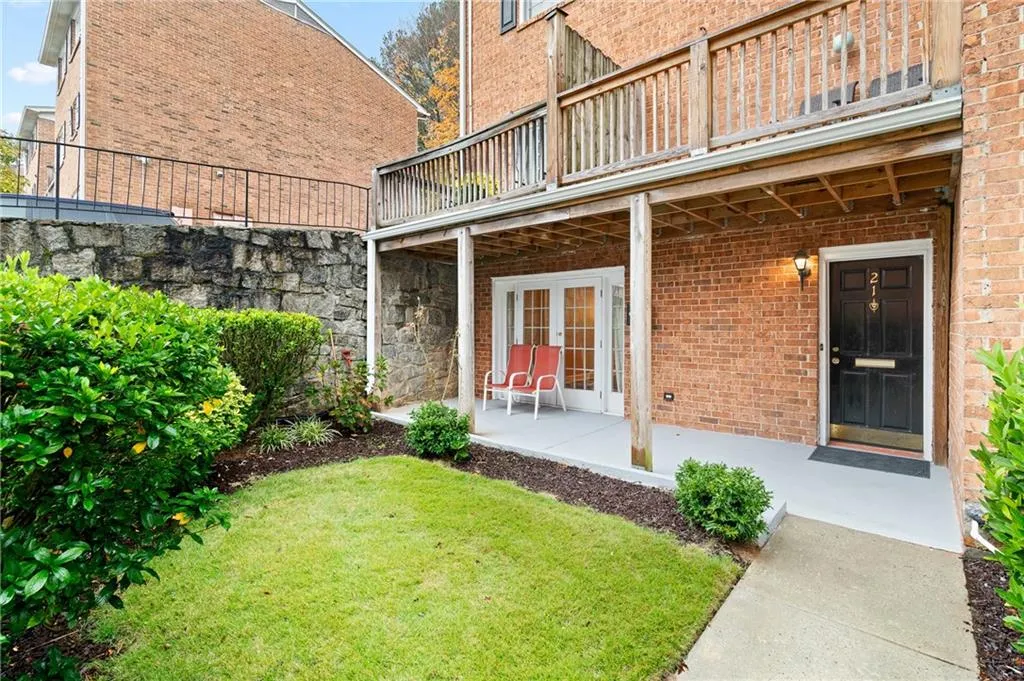 View of yard with a patio area and a balcony