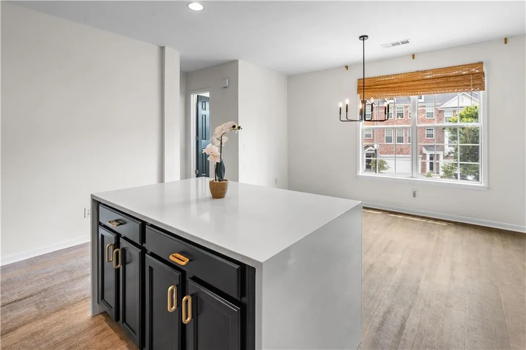 This home features a gorgeous renovated kitchen with waterfall island.