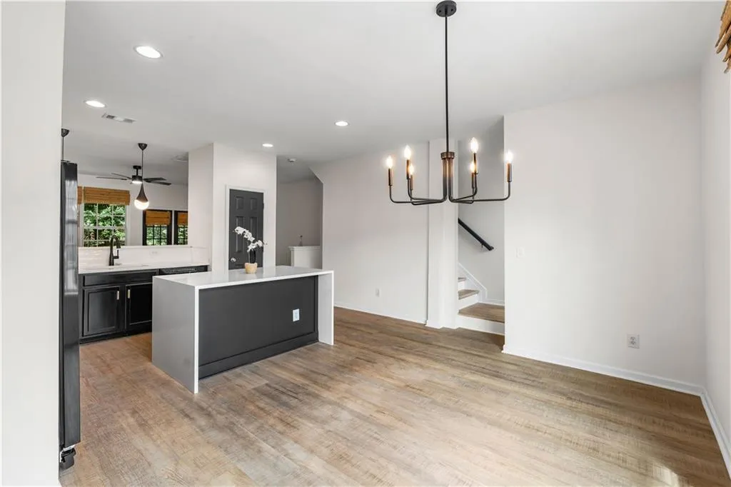 A spacious dining room and an island that allows for three - four stools makes a great space for entertaining!