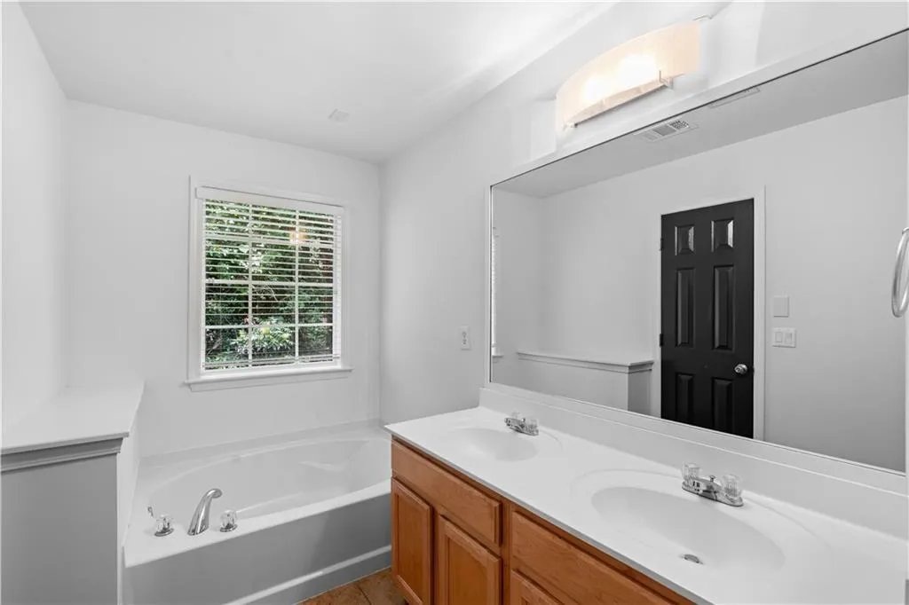 The second soaking tub features beautiful wooded views.
