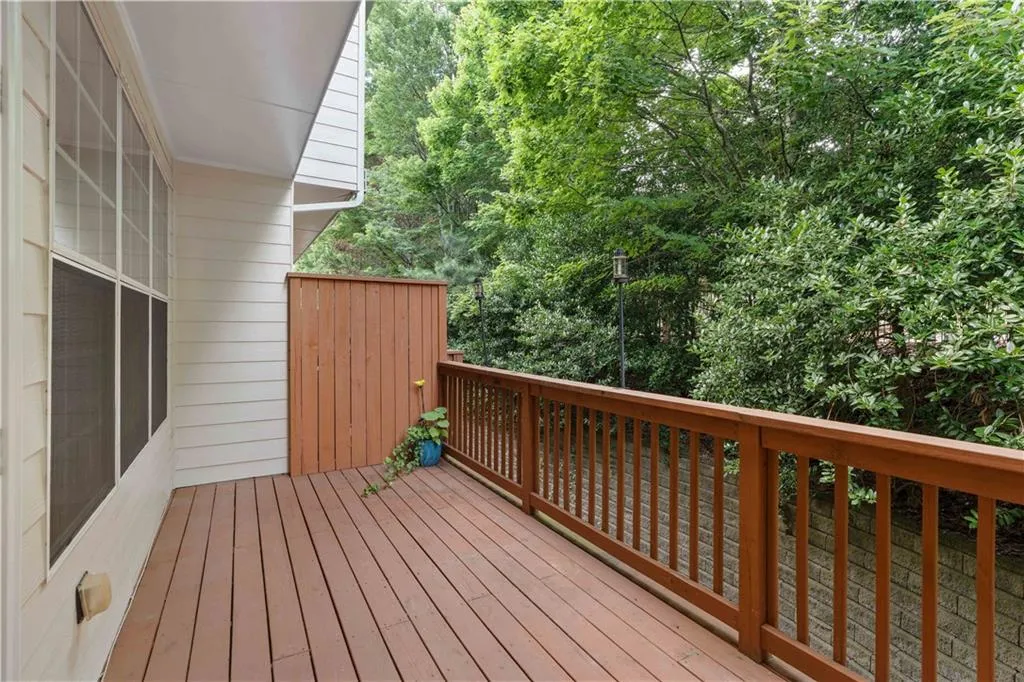 Expansive outdoor wood deck is located right off of the family room.