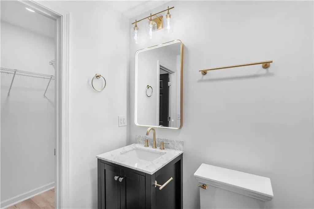 The spacious walk-in closet is just off of the bath.