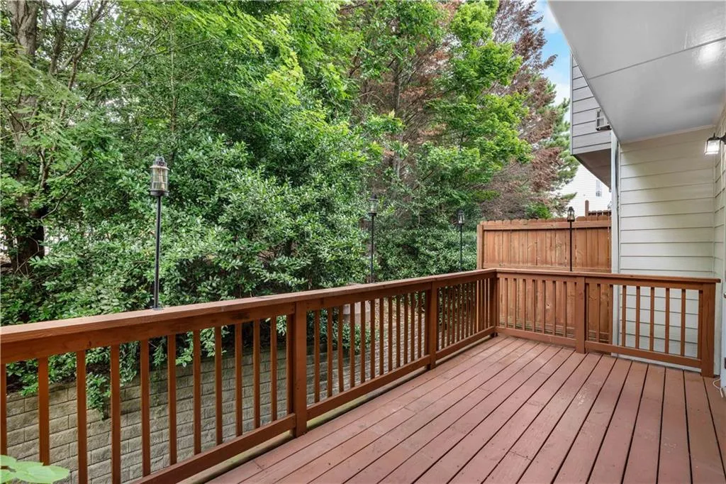 This deck is very private and wooded behind.