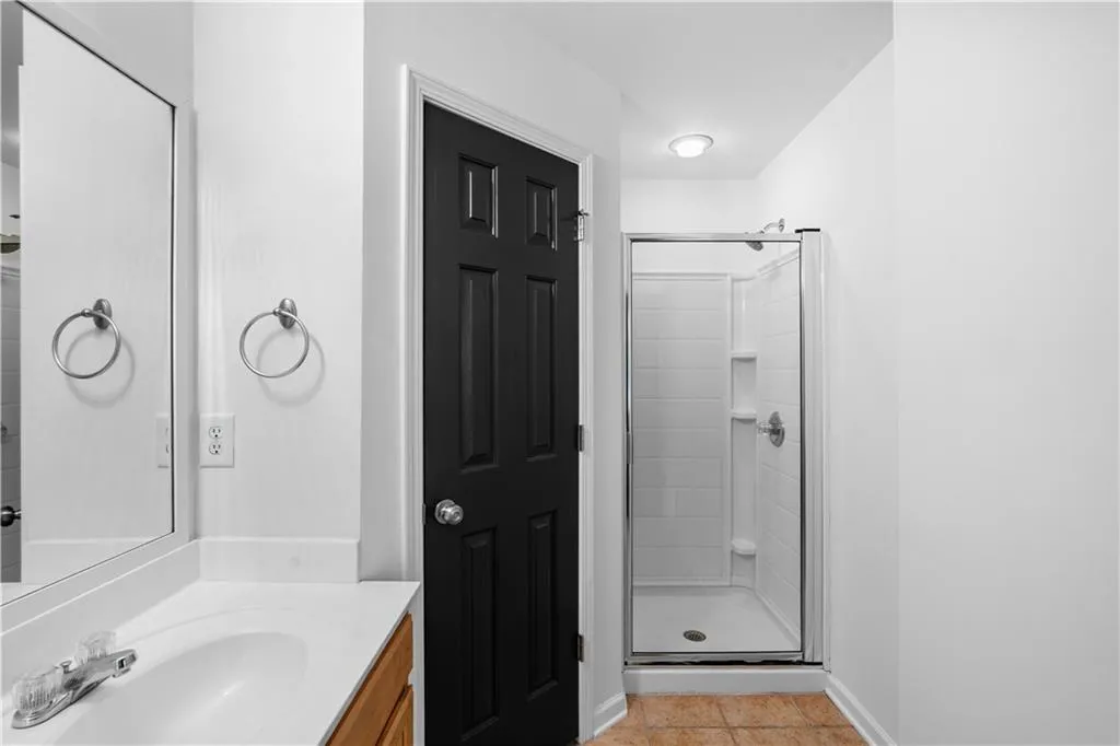 The walk in shower in the second of two primary suites.