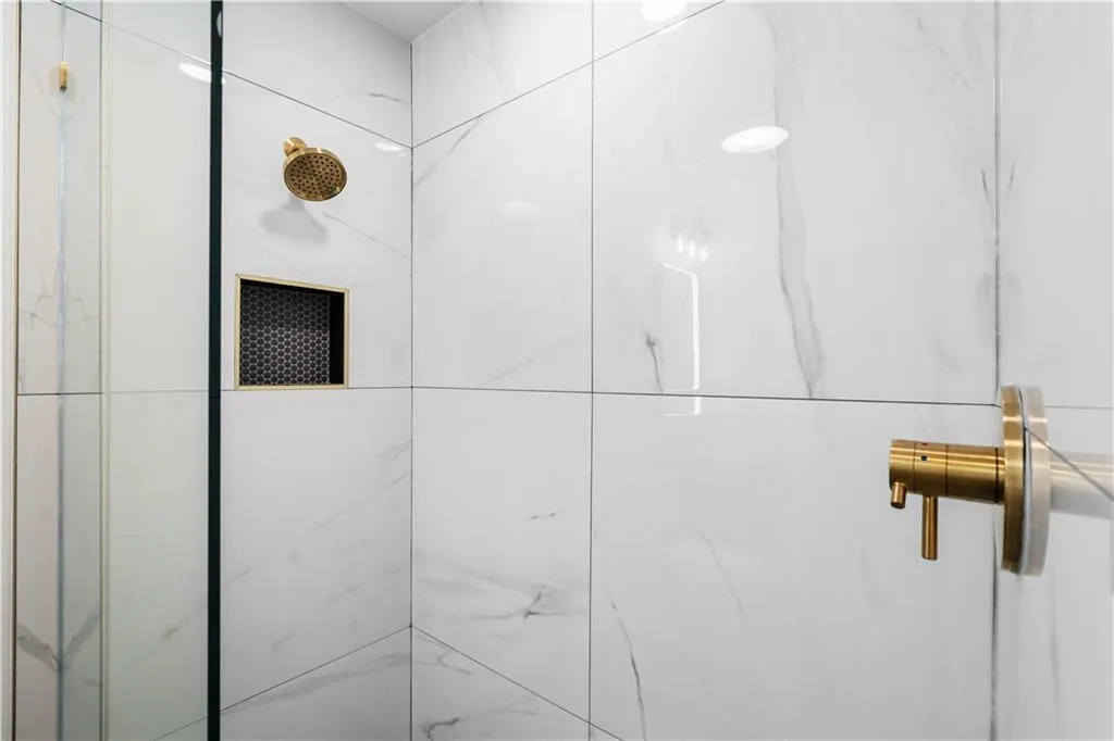 And a niche for your soap and shampoo.