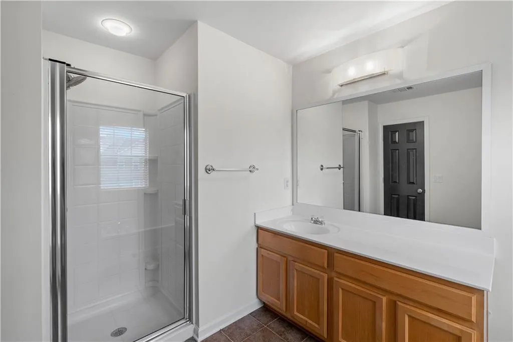 Featuring walk in shower and a soaking tub.