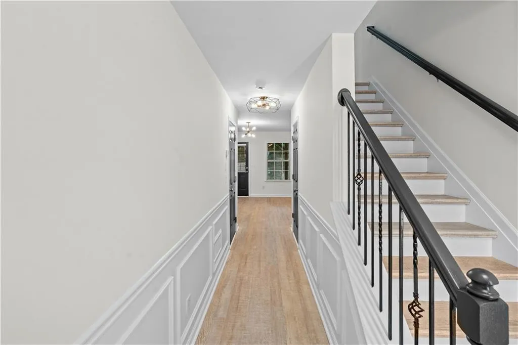 The front entry foyer leads up to the main level of living or straight ahead to the 3rd bedroom with en suite that would also be perfect for an office space or second lounge area.