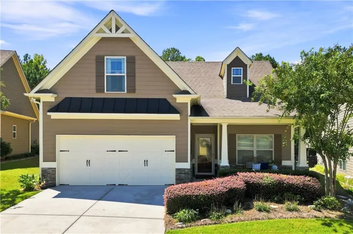 Adorable home with rocking chair front porch
