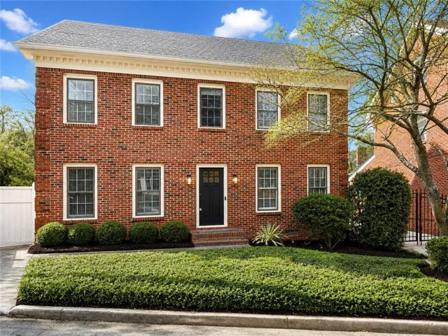 Brick exterior with a distinguished gray roof