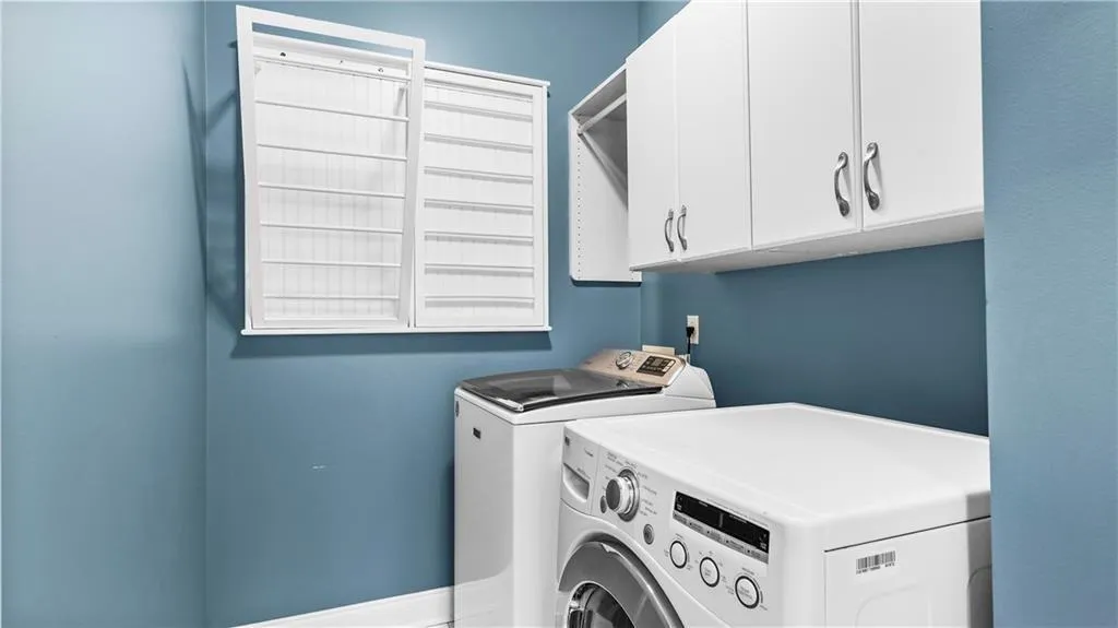 Full Laundry with custom cabinets and hanging rack
