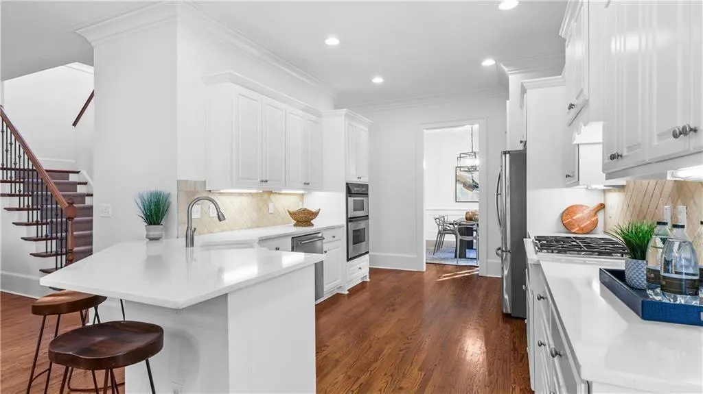 Under cabinet lighting, stainless steel appliances, farm sink, huge drawers and deep cabinets, custom pantry...this kitchen has everything