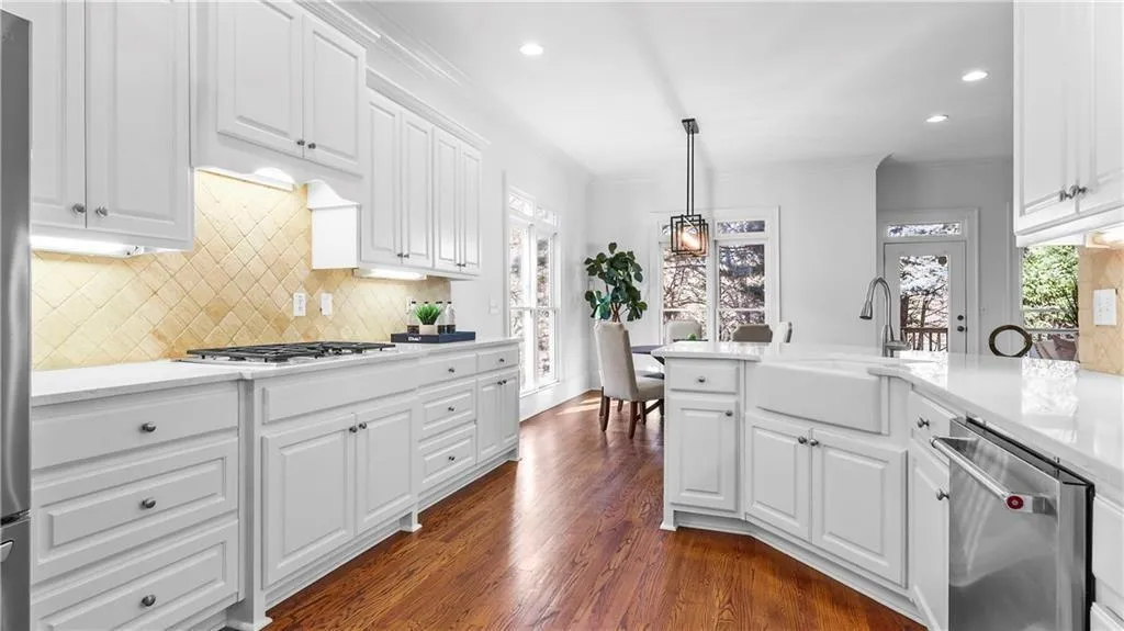 Under cabinet lighting, stainless steel appliances, farm sink, huge drawers and deep cabinets, custom pantry...this kitchen has everything