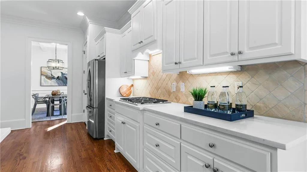 Under cabinet lighting, stainless steel appliances, farm sink, huge drawers and deep cabinets, custom pantry...this kitchen has everything