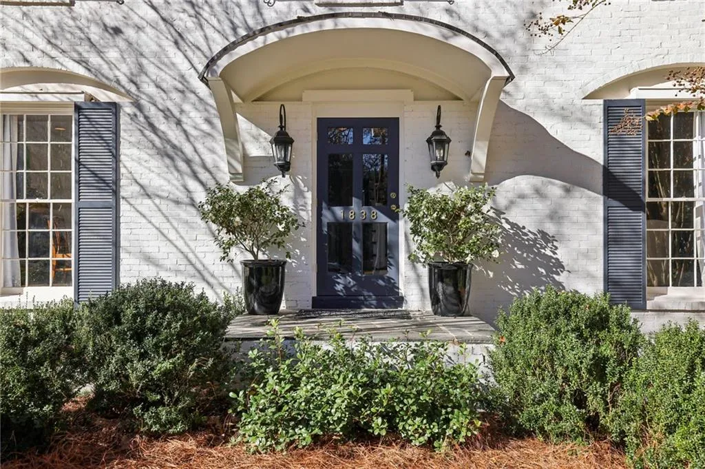 View of exterior entry with brick siding