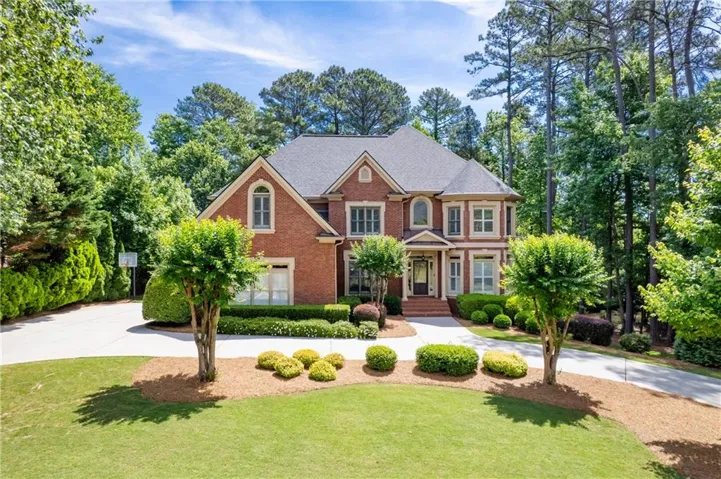Traditional brick exterior with multiple gables and arched windows