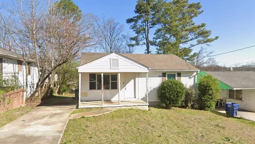 Single-story property featuring white siding and a covered front porch