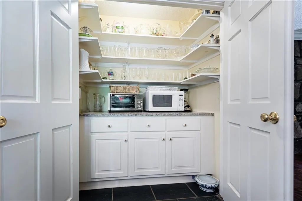 The butler's pantry in tucked neatly behind double doors in the kitchen/breakfast room.