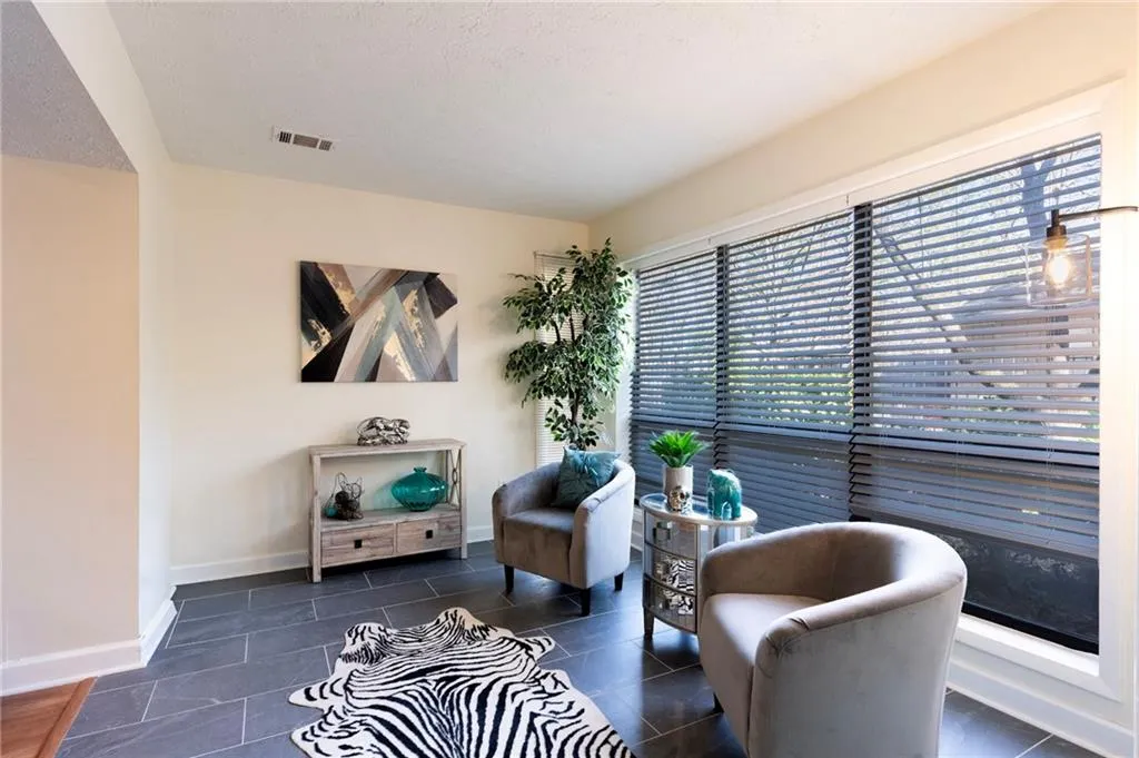 Sun room/Sitting room/Breakfast room   featuring dark tile patterned flooring